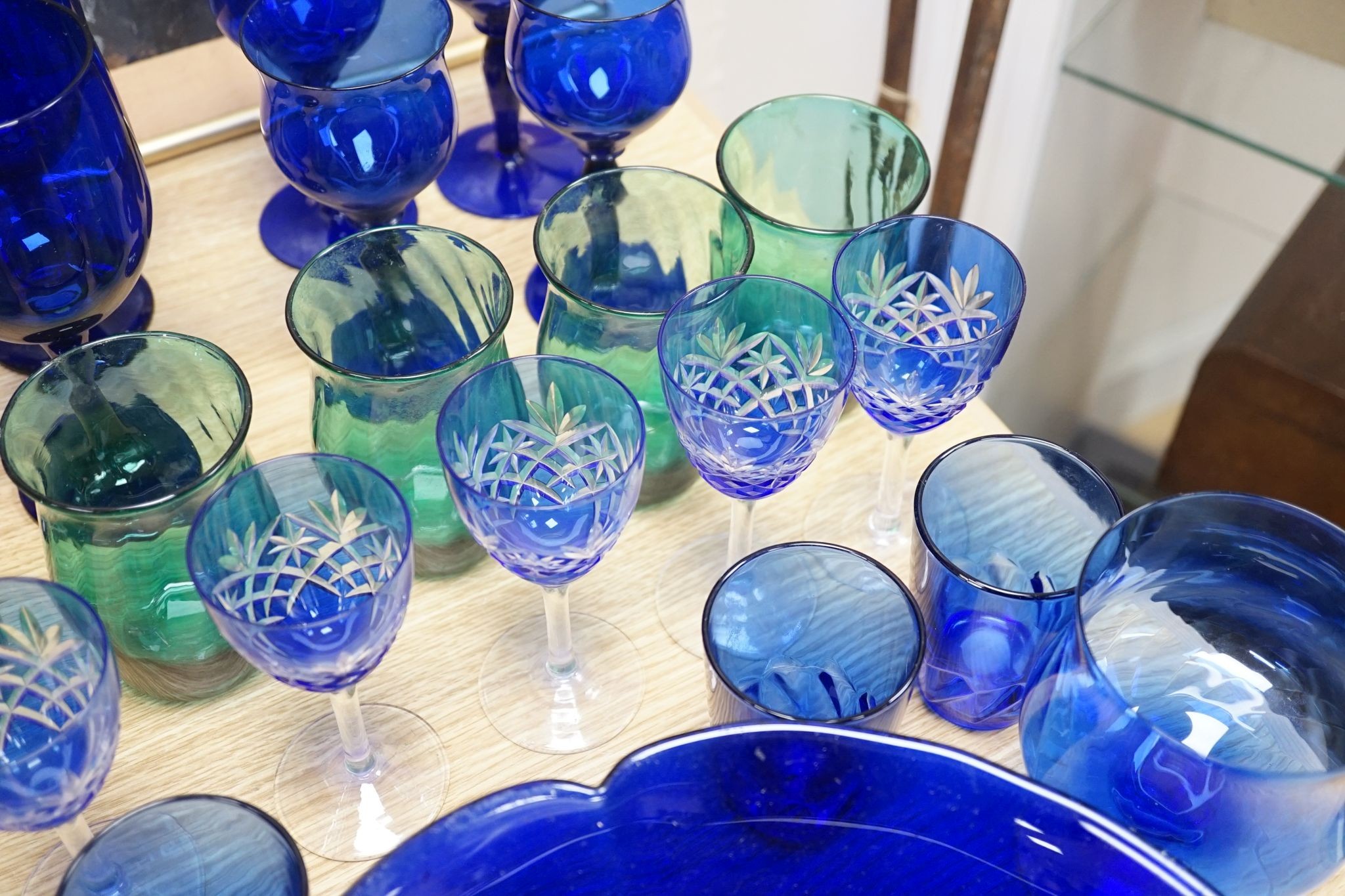 A mixed group of coloured glassware